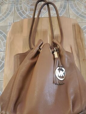 Michael Kors Tan Pebbled Leather Drawstring Shoulder Bag with MK Charm